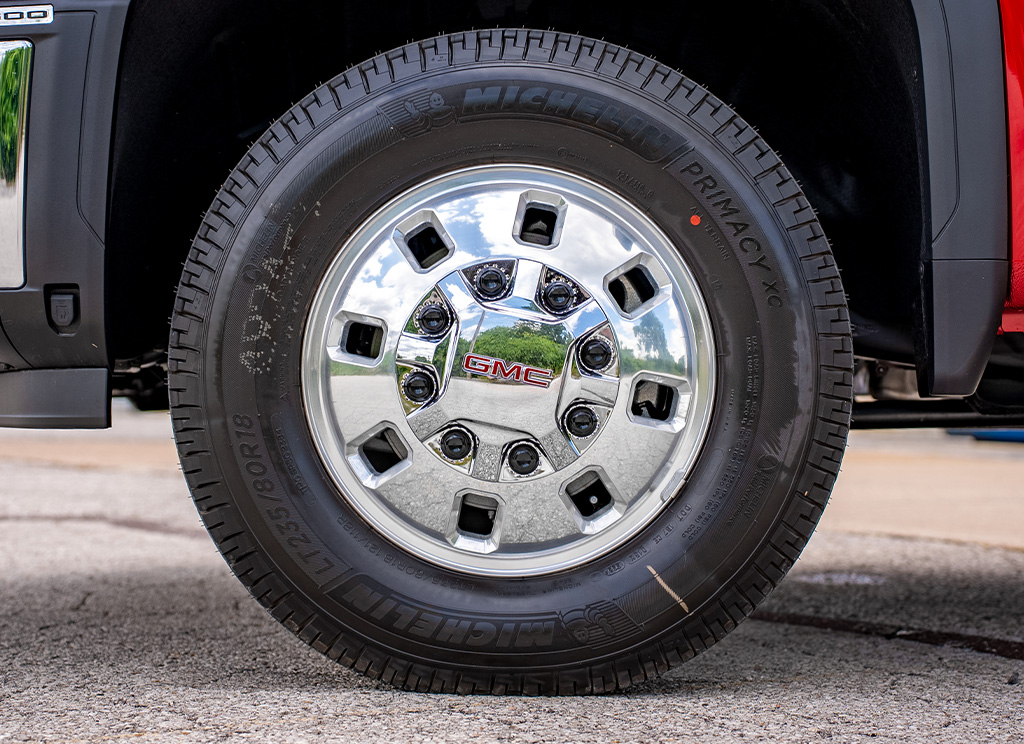 Standard factory chrome GMC Sierra HD wheels.