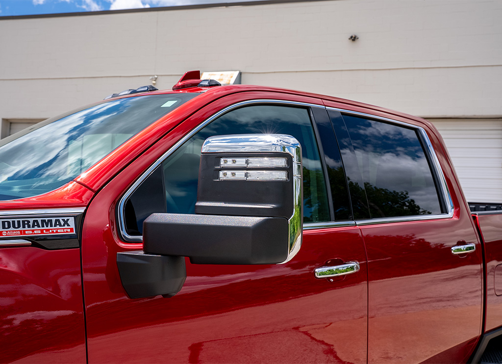Factory standard chrome 2025 GMC Sierra HD window trim and mirror caps.