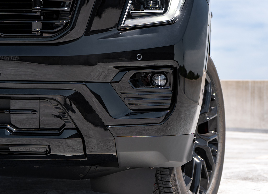 Close up of custom black fog bezel molding on the 2025 GMC Yukon.