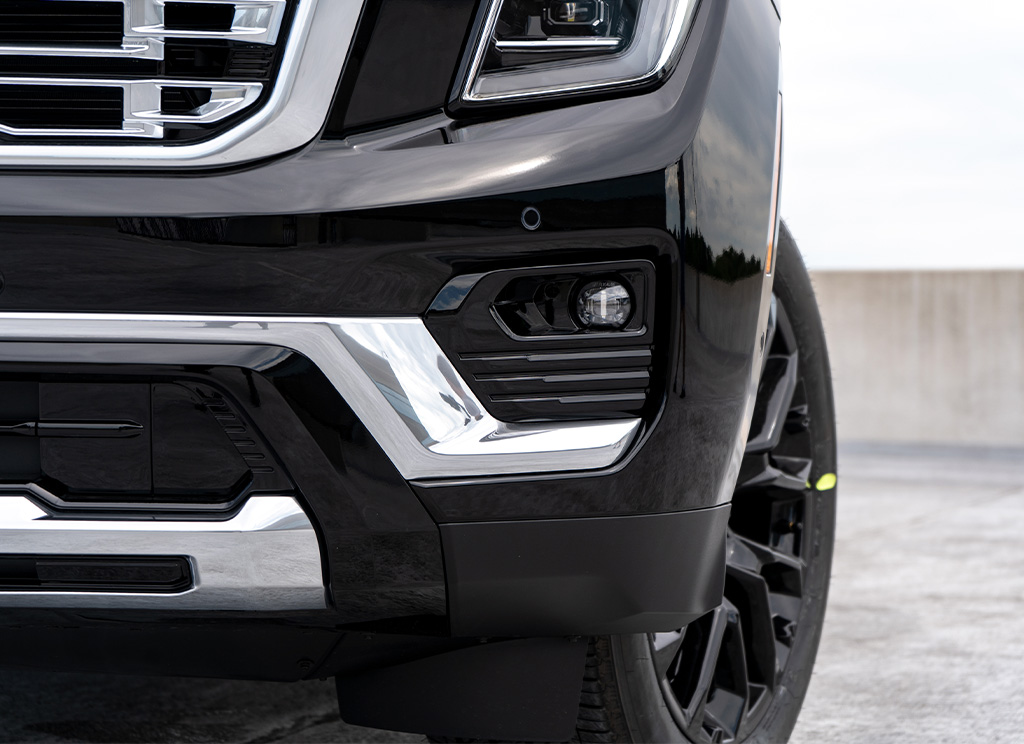 Close up of factory chrome fog bezel molding on the 2025 GMC Yukon.