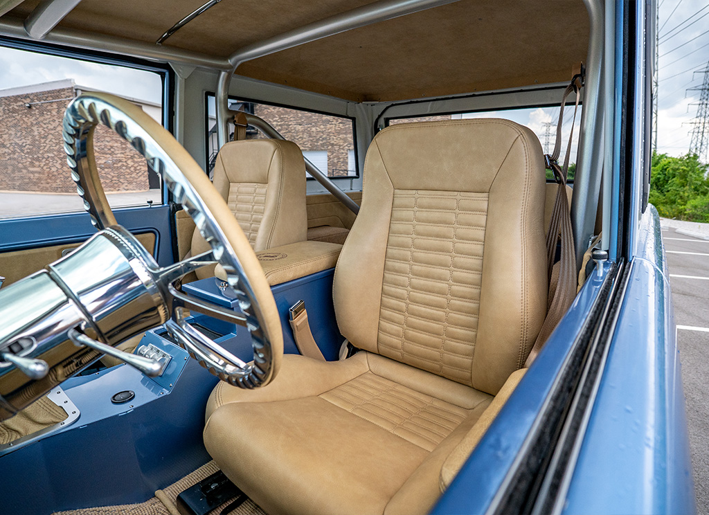 Custom cashew colored leather interior driver seat without head rests in a vintage restored 1971 Ford Bronco.