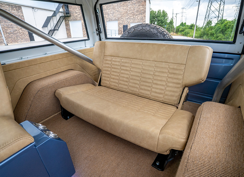 Custom cashew colored leather interior rear bench seat in a restored 1971 Ford Bronco.