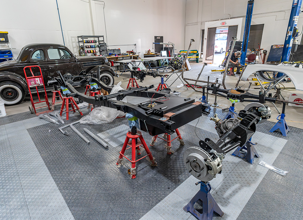 Restored chassis including custom fuel tank and axles of a 1971 Ford Bronco.