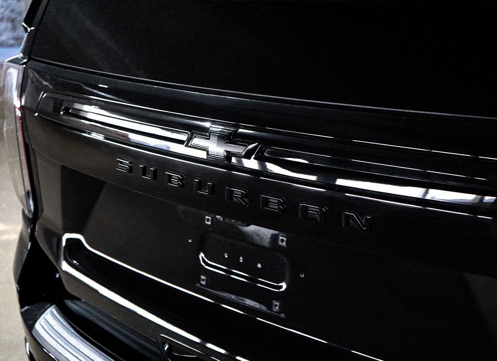 Blackout rear hatch valance and Suburban nameplate.