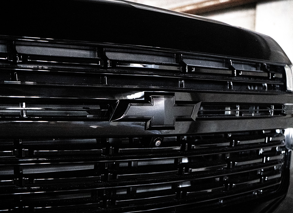 Black Chevrolet bowtie emblem on the 2024 Chevy Suburban.