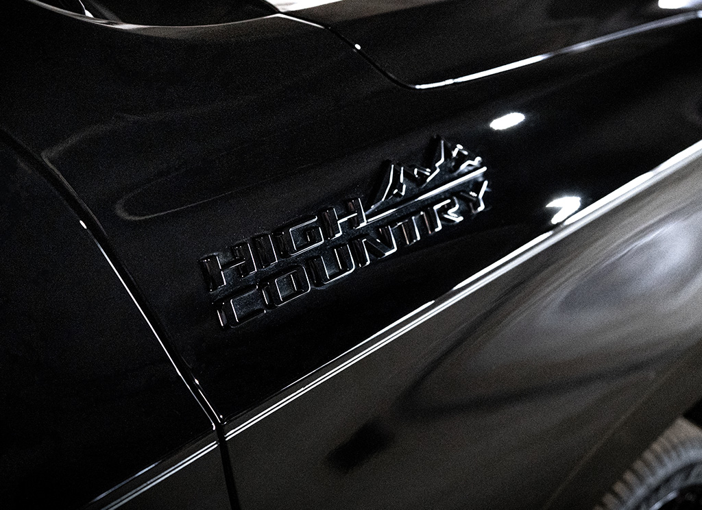 Blackout high country badging on a Chevy Suburban.