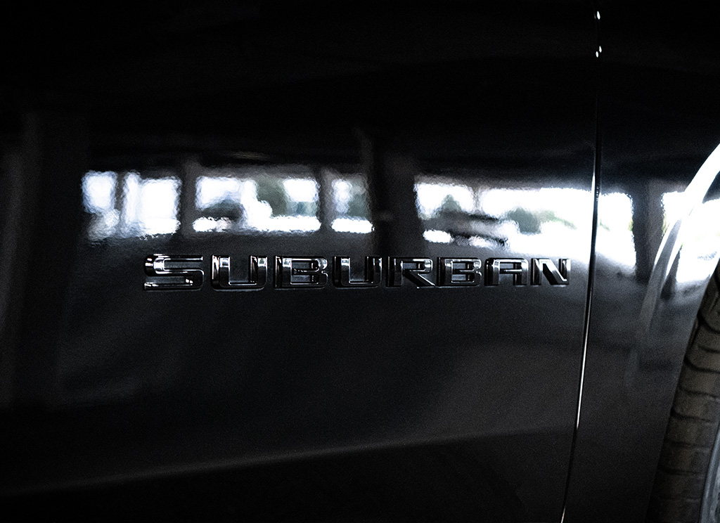 Black Suburban nameplate lettering.