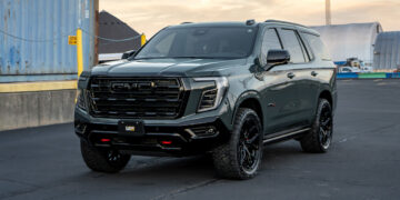 2026 GMC Yukon AT4 in Midnight Pine Green with black chrome delete trim.