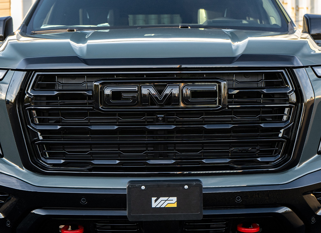 2026 GMC Yukon AT4 custom blackout grille close-up.