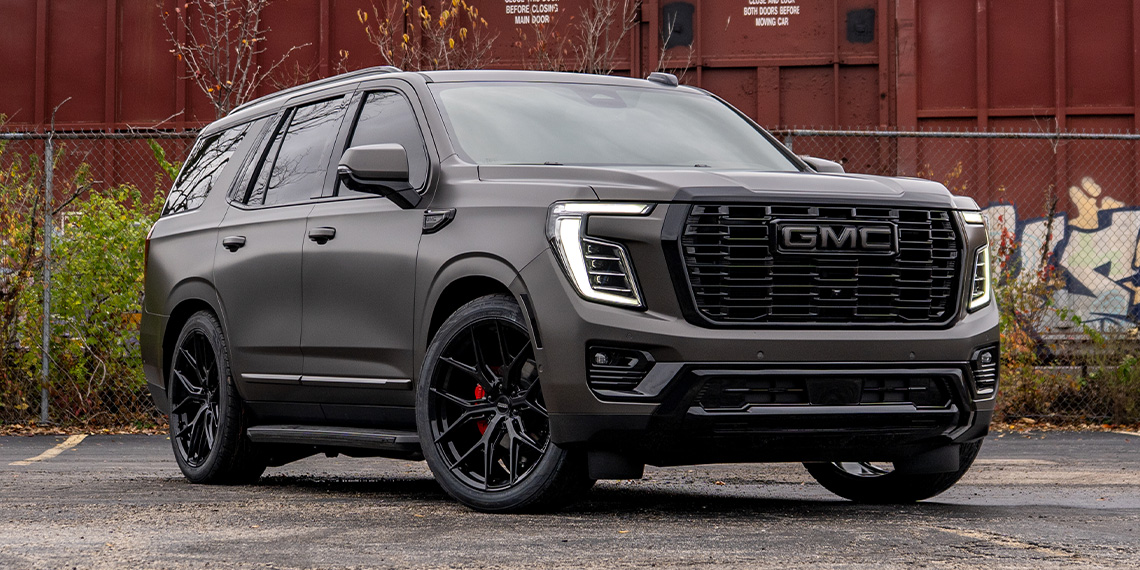 Custom 2026 GMC Yukon Denali with a lowering kit and satin gray wrap.