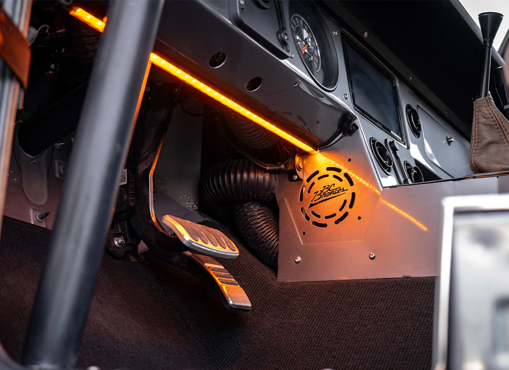 Amber LED light strip under dash of a restored 1972 Ford Bronco. 