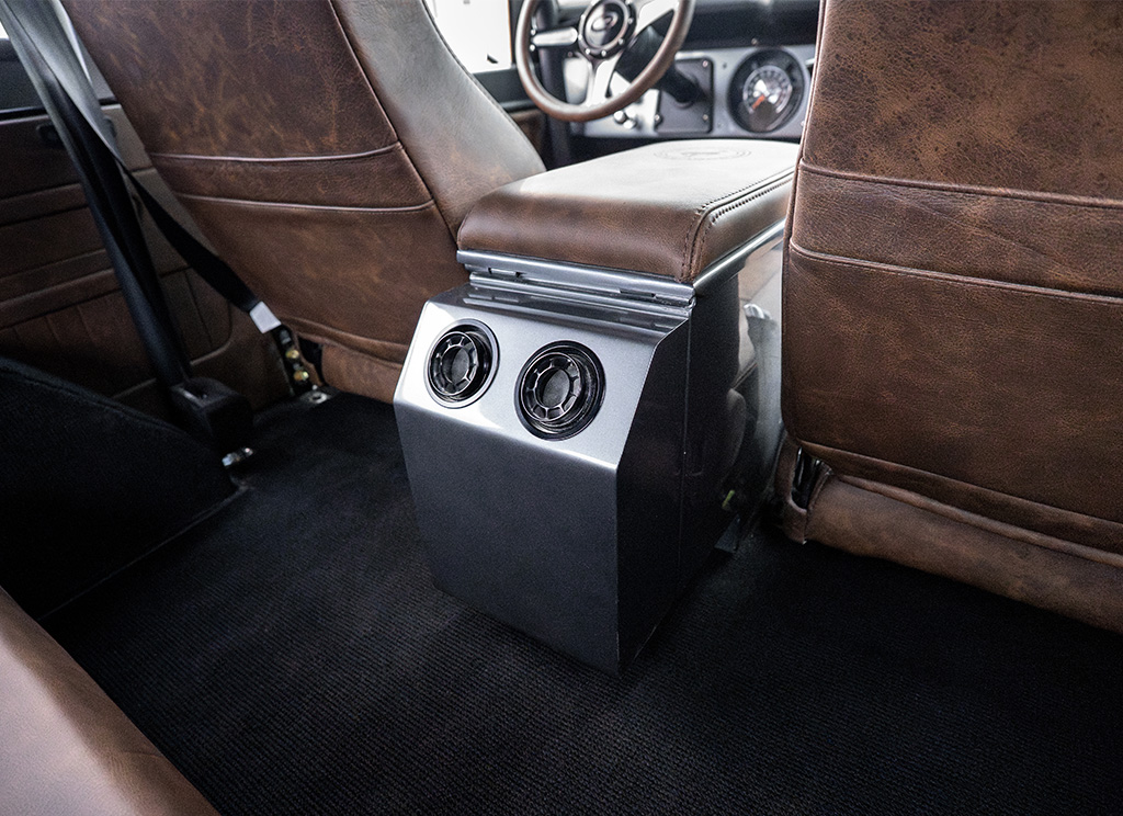 Spherical aluminum air vents of the rear custom center counsel of a restored 1972 Ford Bronco.