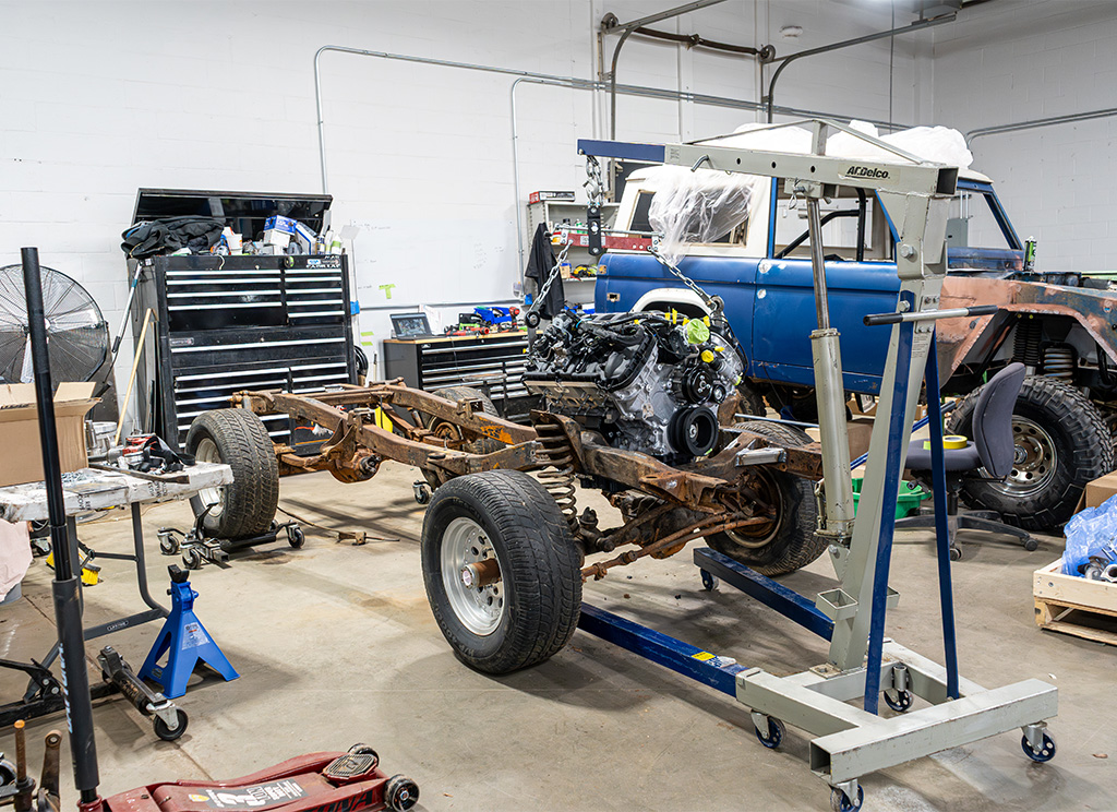 Rusted chassis of a 1972 Ford Bronco before being restored.