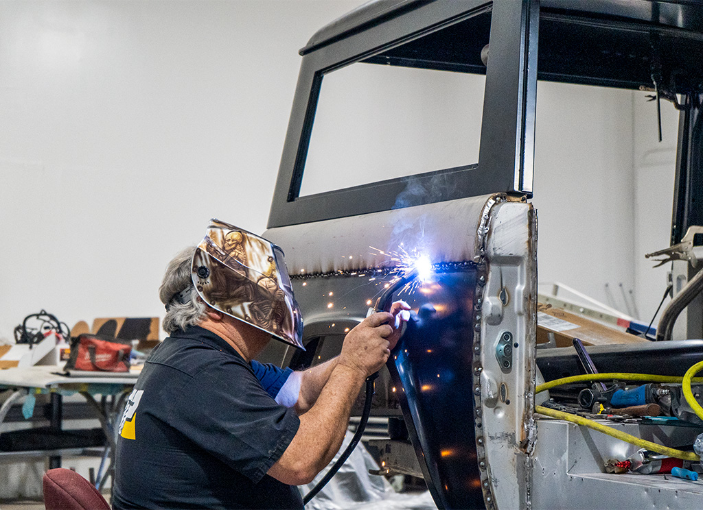 Welding a fabricated quarter panel onto a 1972 Ford Bronco restomod.