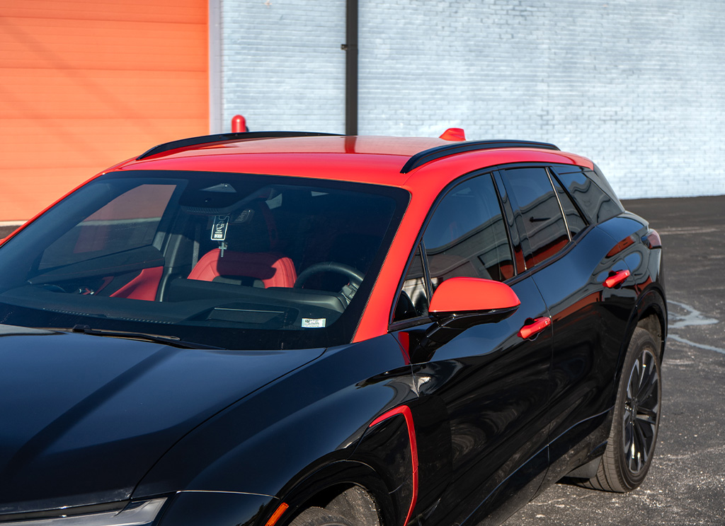 Close-up of a red vinyl roof wrap on a 2025 Chevy Blazer EV.