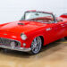 Restored 1956 Ford Thunderbird restomod with red paint and custom convertible top.