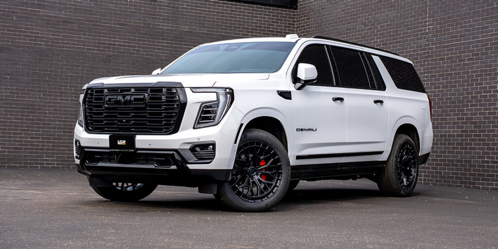 White 2026 GMC Yukon Denali with blackout chrome delete trim and custom accessories.