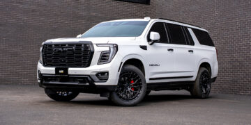 White 2026 GMC Yukon Denali with blackout chrome delete trim and custom accessories.