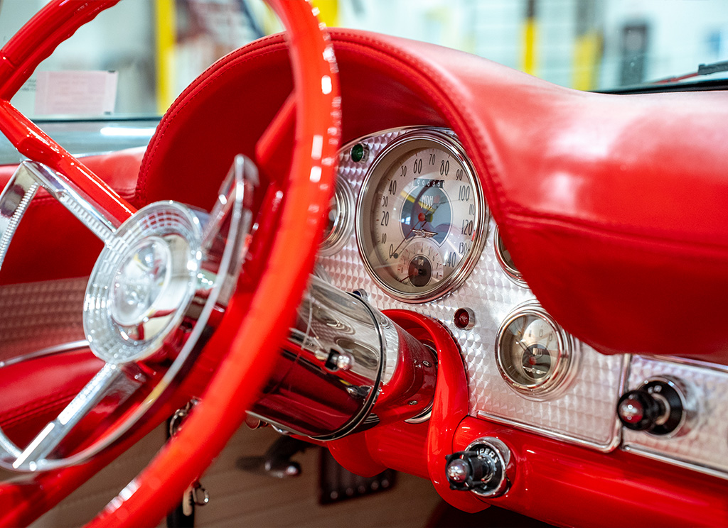 Custom 1957 Ford Thunderbird polished aluminum dashboard with vintage-style gauges.