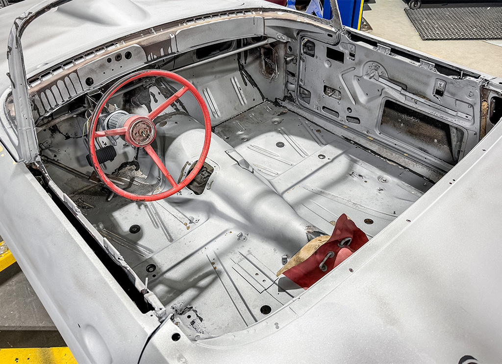 Stripped interior of a 1956 Ford Thunderbird.