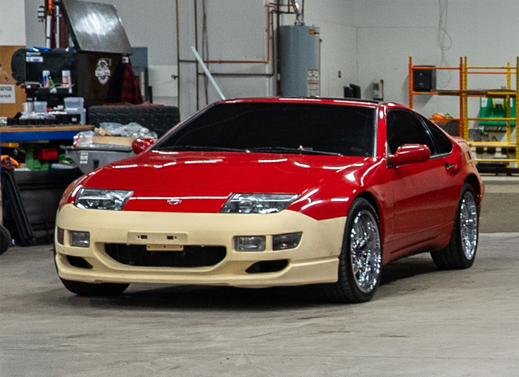 Original Red 1991 Nissan 300ZX with front bumper repair.