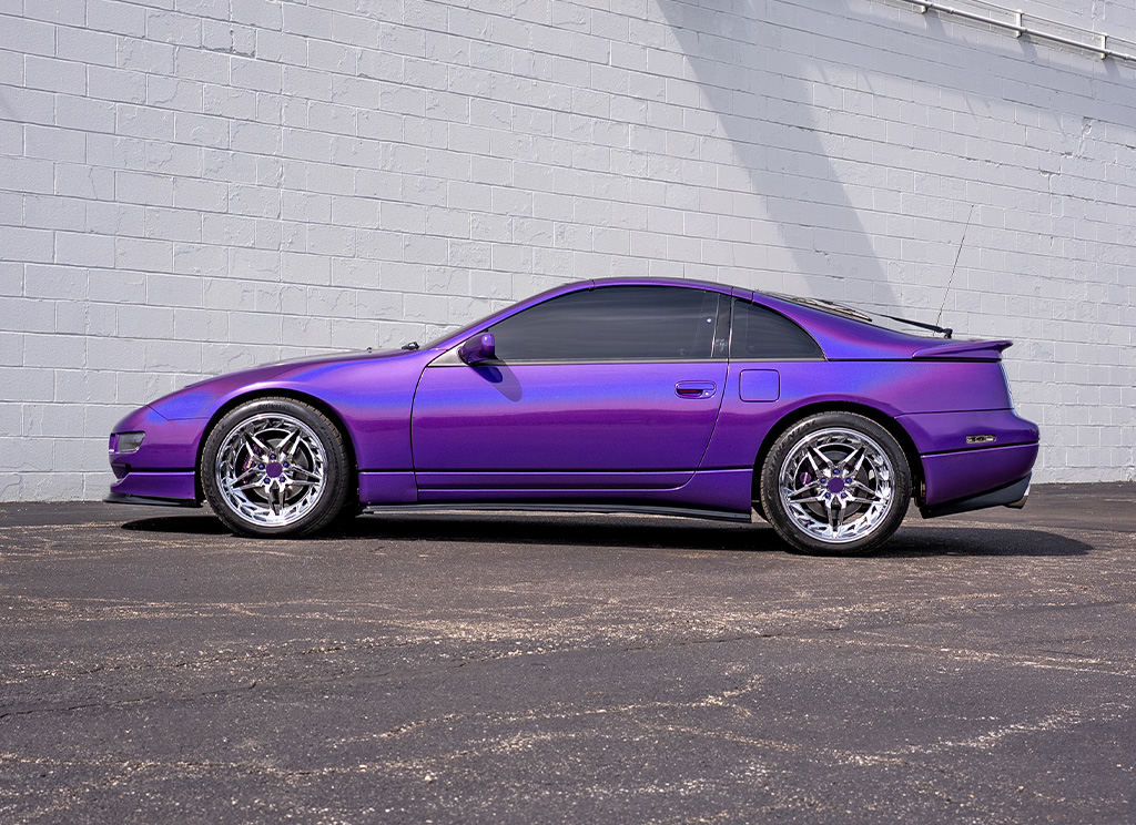 Side profile view of a custom color-flip purple 1991 Nissan 300ZX.