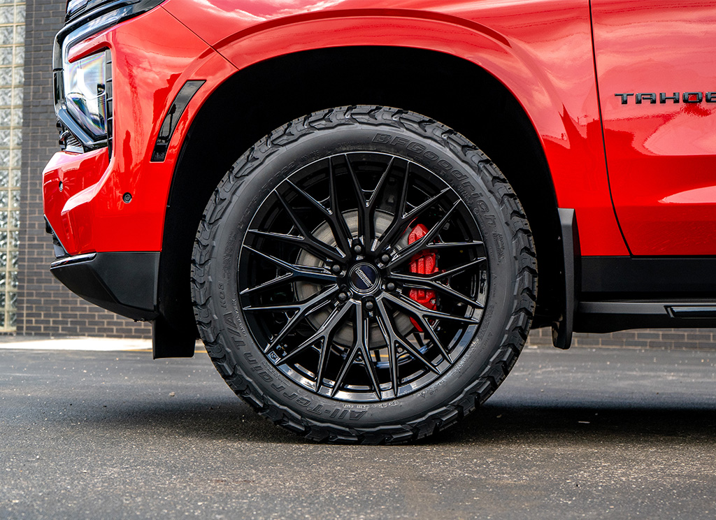 Gloss black Vossen HFX-6 wheels on a custom 2026 Chevy Tahoe.