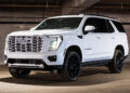 Custom 2026 GMC Yukon Denali Ice White Color-matched grille and blackout chrome delete trim.