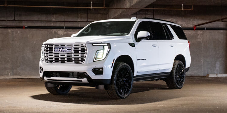 Custom 2026 GMC Yukon Denali Ice White Color-matched grille and blackout chrome delete trim.