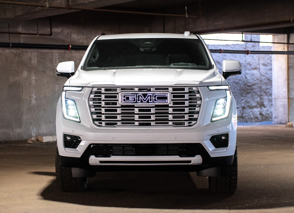 Custom White Frost 2026 GMC Yukon Denali with a color matched grille and blackout chrome delete trim.