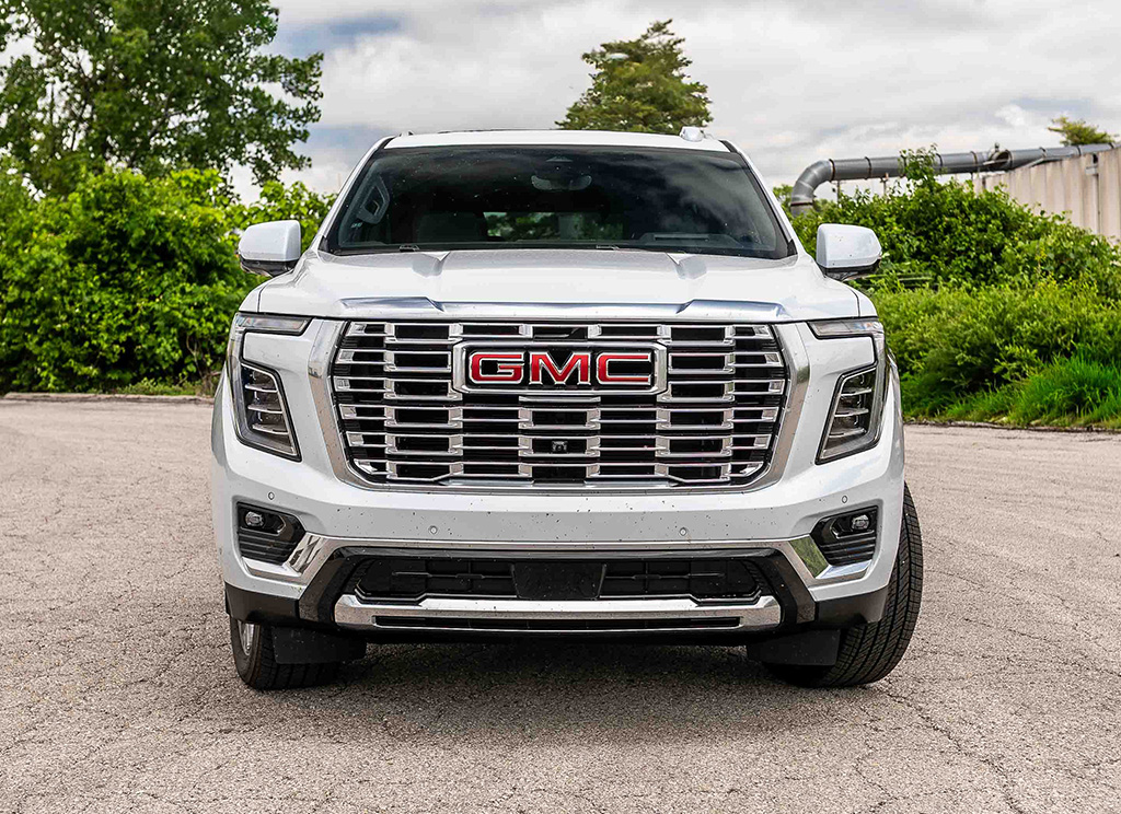 Front facing view of an original factory stock 2026 GMC Yukon Denali in White Frost.